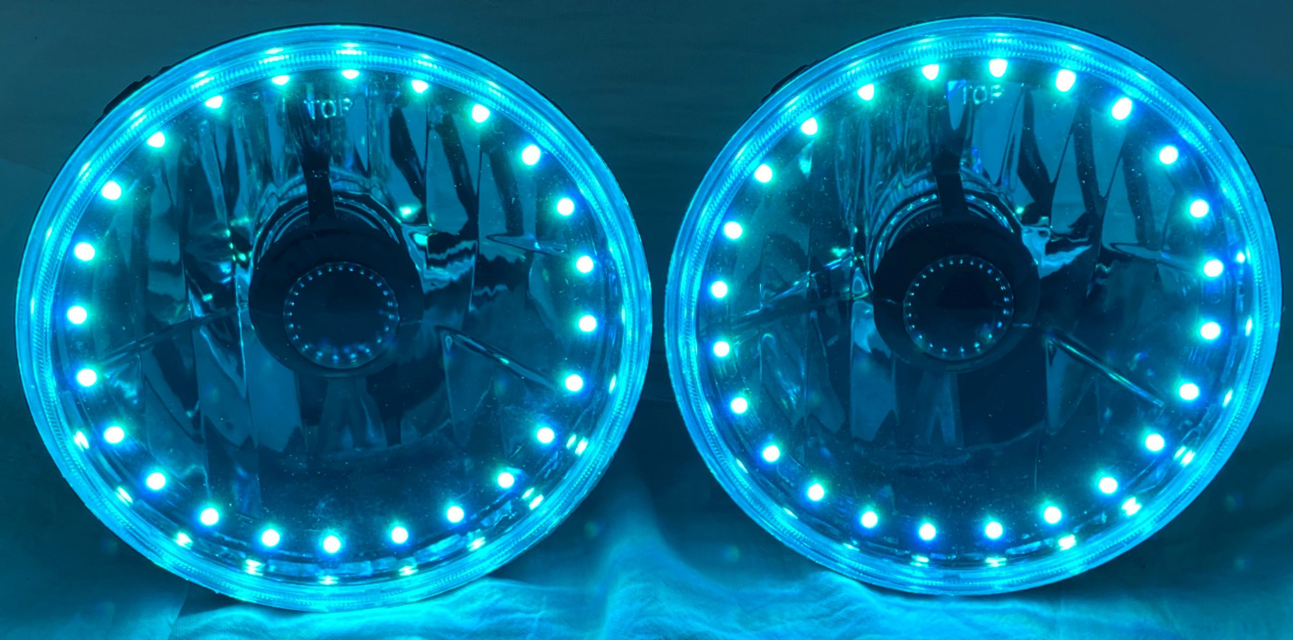 One Pair of 7 Inch Round Elite Diamond Multi-Color Halo Black Illusion ™ Headlights with Clear Halogen Bulbs