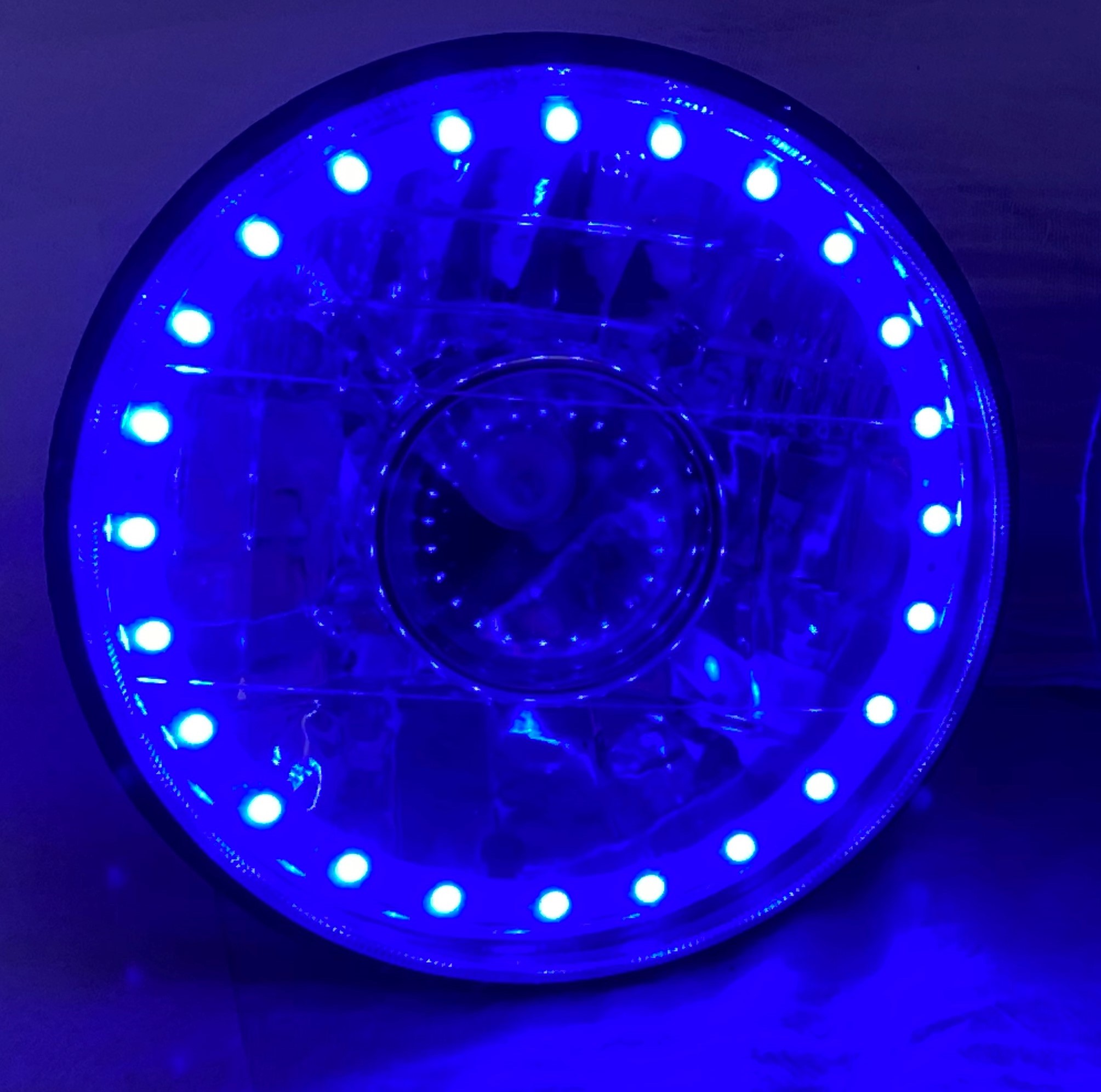 One Each of 7 Inch Round White Diamond Projector Multi-Color Halo Headlight with a Blue Halogen Bulb